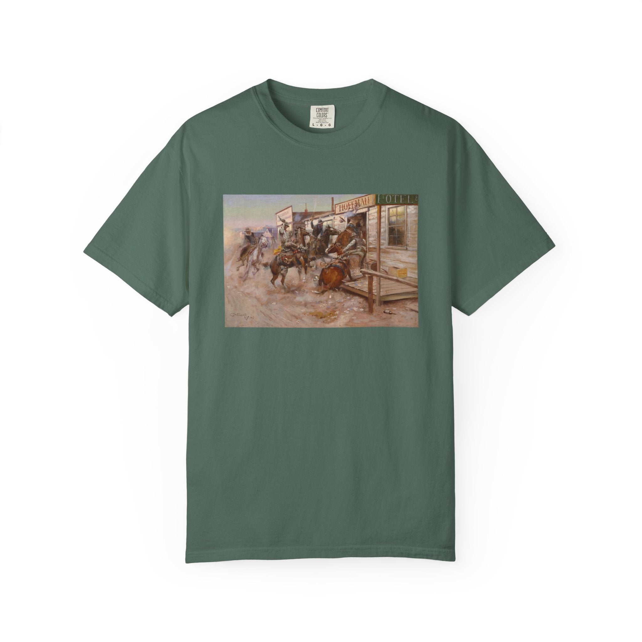 Green T‑shirt featuring Charles Marion Russell’s In Without Knocking, showing cowboys riding horses into a frontier town, causing commotion outside a saloon.