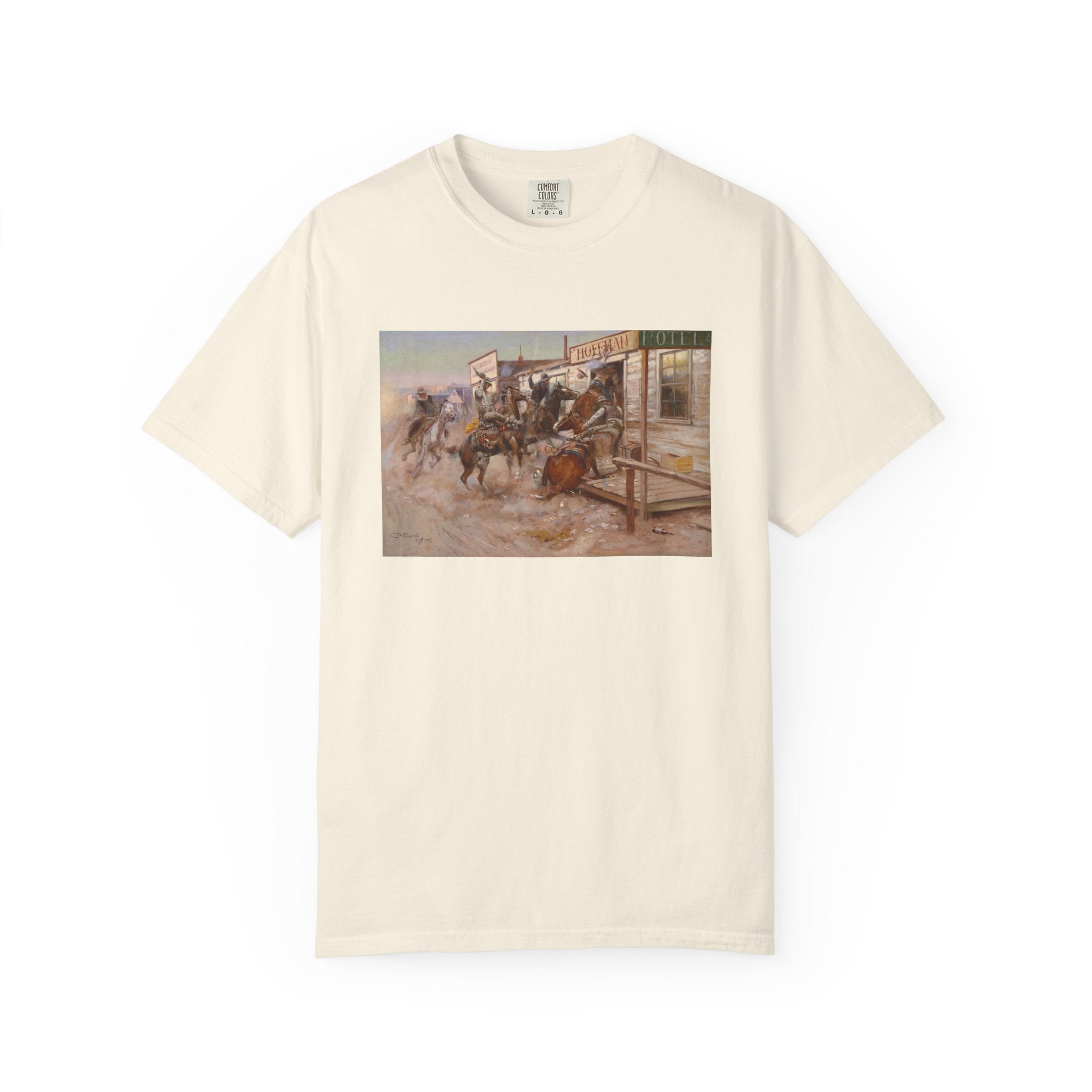 Beige T‑shirt featuring Charles Marion Russell’s In Without Knocking, showing cowboys riding horses into a frontier town, causing commotion outside a saloon.