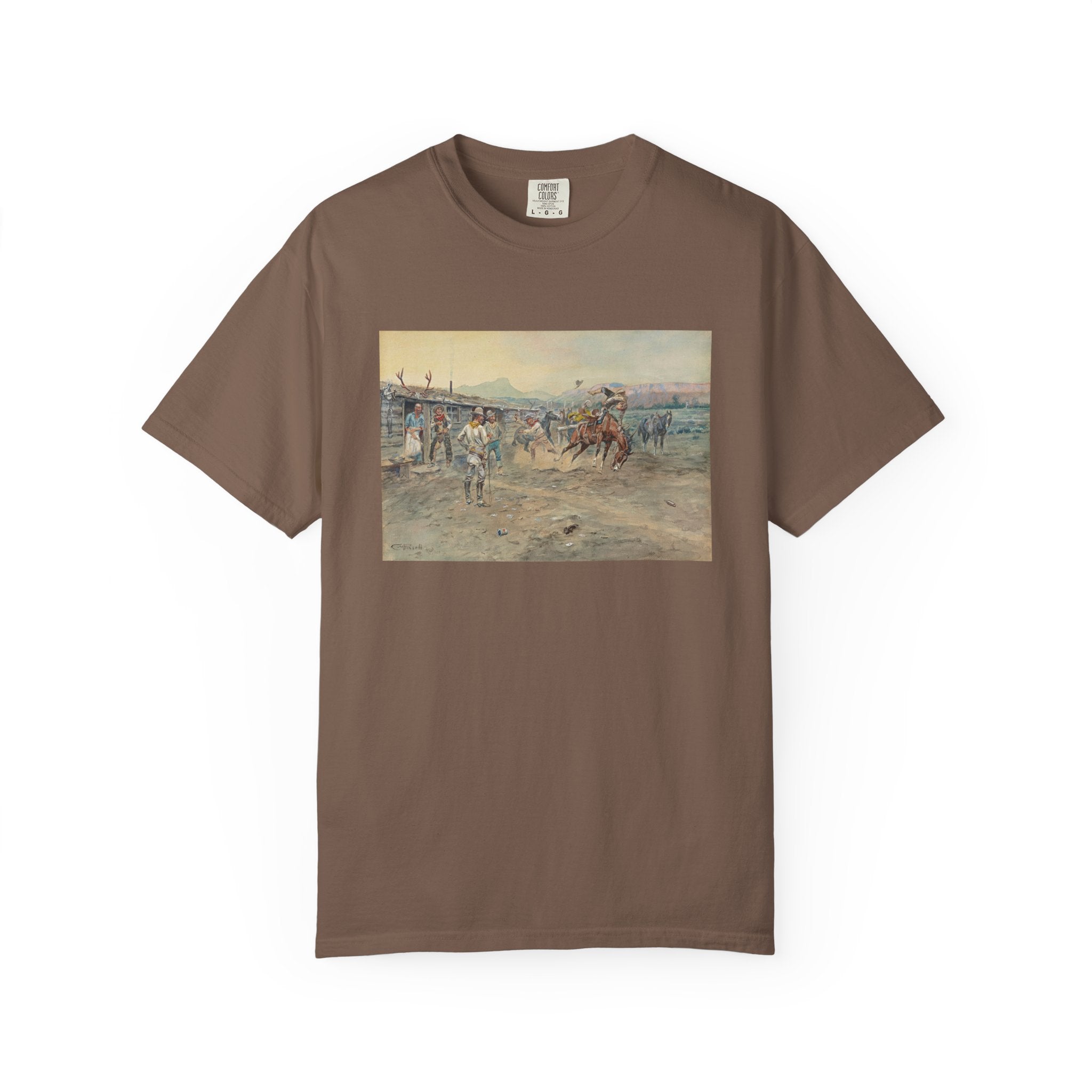 Brown T‑shirt featuring Charles Marion Russell’s The Tenderfoot, showing a tenderfoot being thrown from a bucking horse while cowboys look on in a lively Western scene.