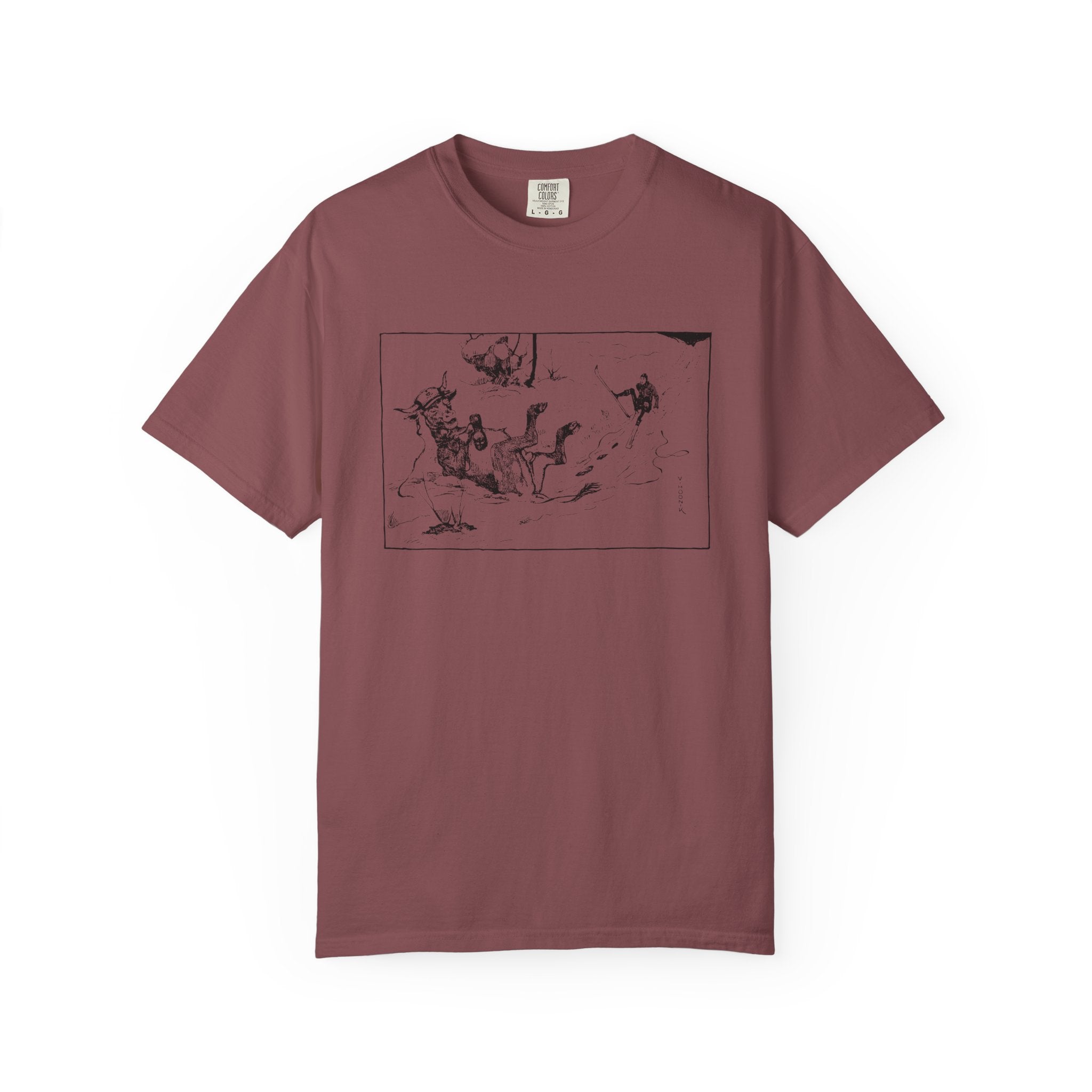 Maroon T‑shirt featuring Valentin Hodnik’s artwork, showing a skier and a cow nearly colliding on a snowy slope.