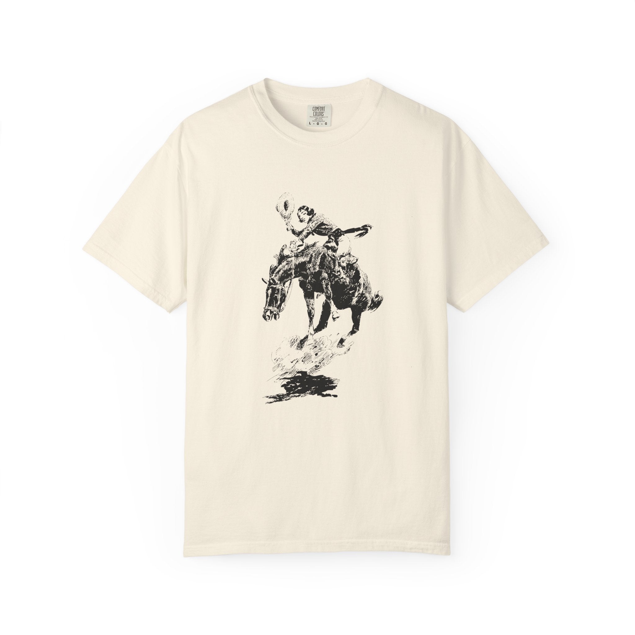 Beige T-shirt featuring a black-and-white sketch of Charles Marion Russell’s Bucking Horse and Cowgirl, showing a cowgirl riding a bucking horse.