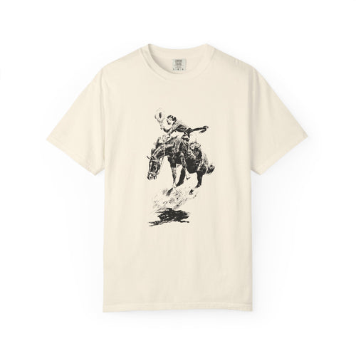 Beige T-shirt featuring a black-and-white sketch of Charles Marion Russell’s Bucking Horse and Cowgirl, showing a cowgirl riding a bucking horse.