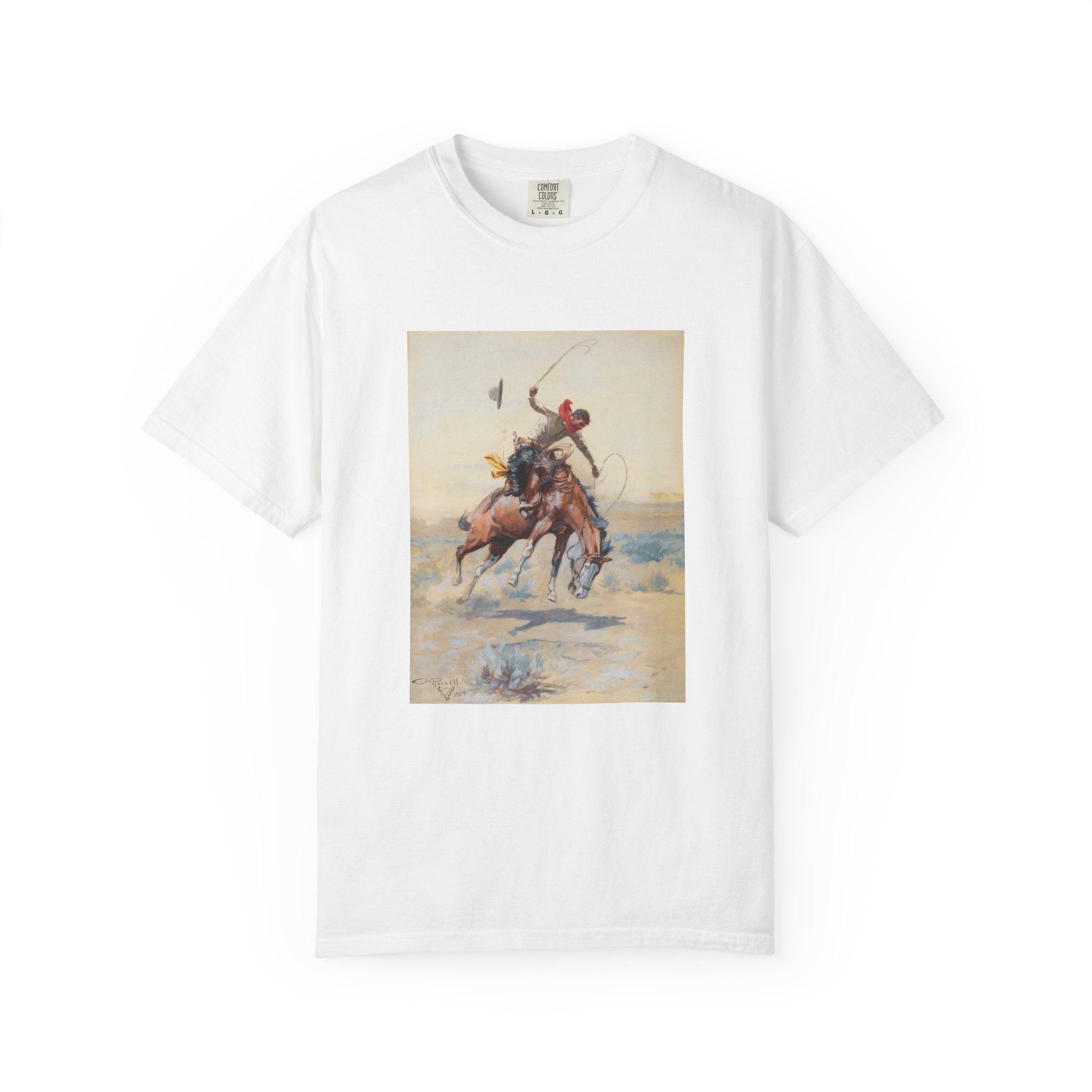 White T-shirt featuring Charles Marion Russell’s The Bucker, showing a cowboy riding a bucking horse in a Western landscape.
