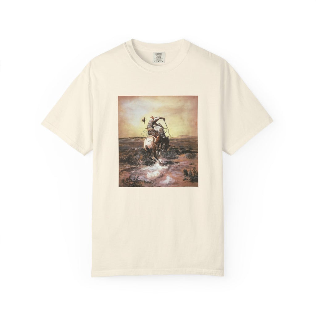 Beige T‑shirt featuring Charles Marion Russell’s A Slick Rider, showing a cowboy riding a bucking horse.